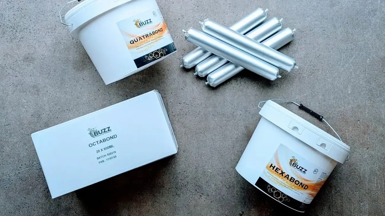 Buzz-branded adhesive products, Quatrabond, Octabond and Hexabond, laid out on a warehouse floor