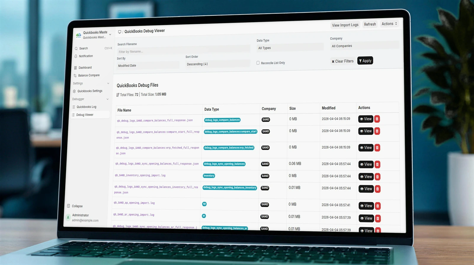 Laptop showing the QuickBooks Debug Viewer in ERPNext listing each stored API response with its data type, company and date