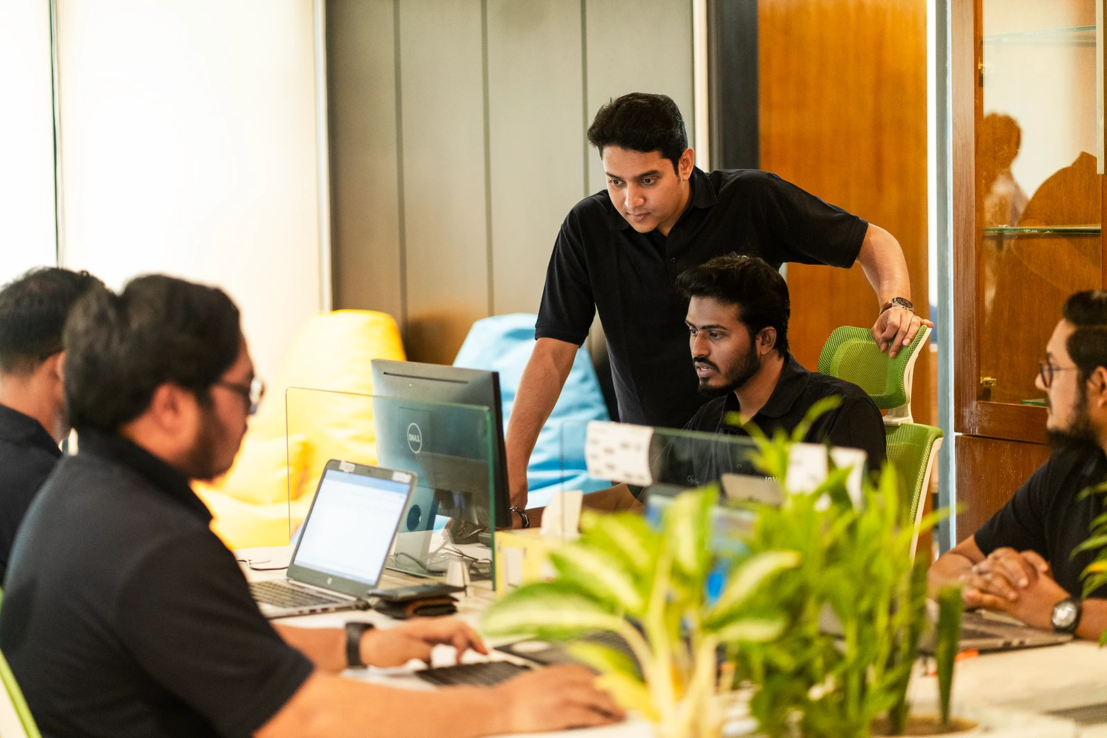 Our colleagues reviewing work together around an office table